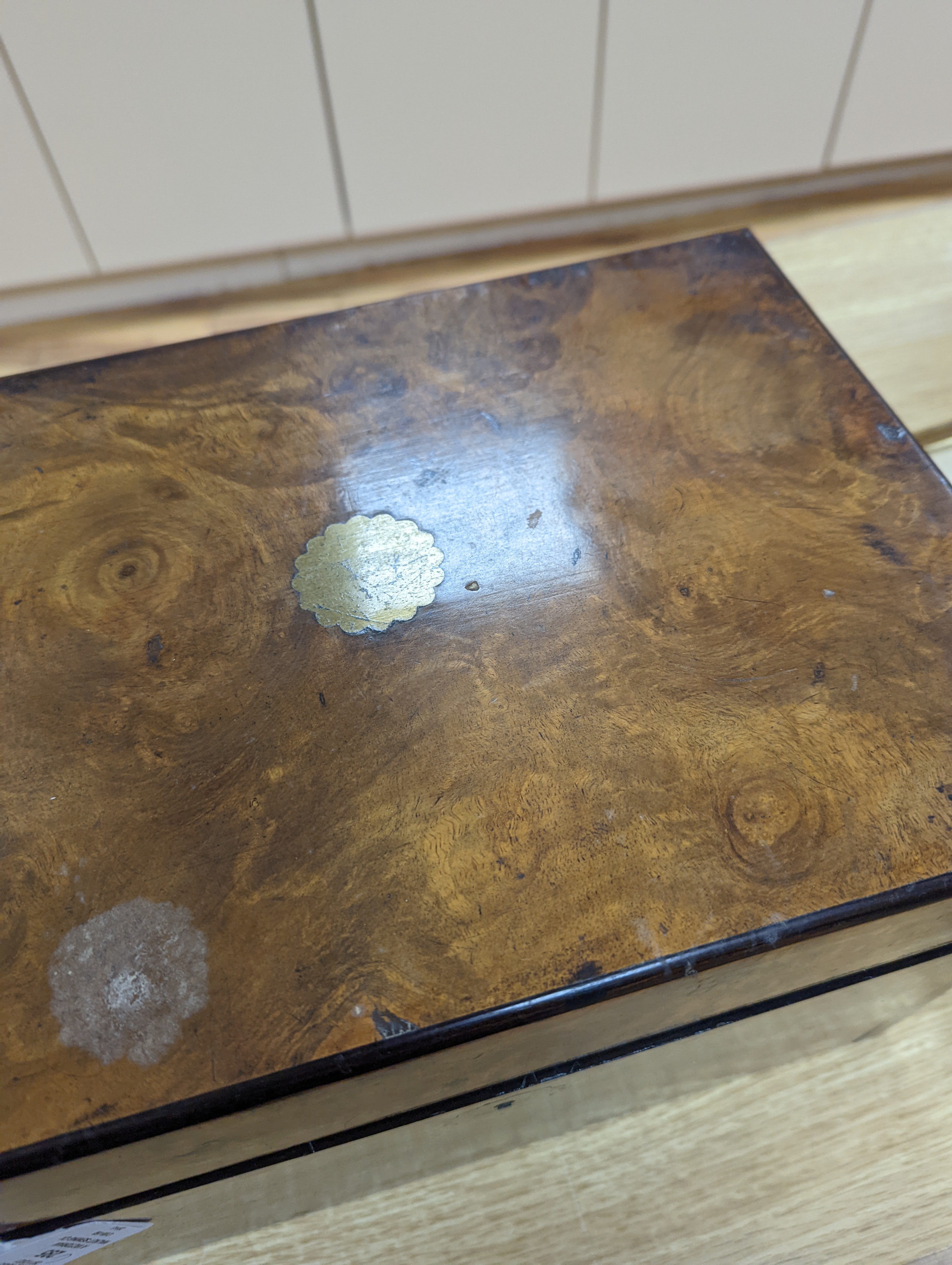 A Victorian walnut sewing casket, 34cm, containing sewing related accessories